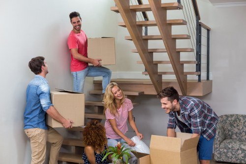 Loading items securely into a removal van with safety checks in place