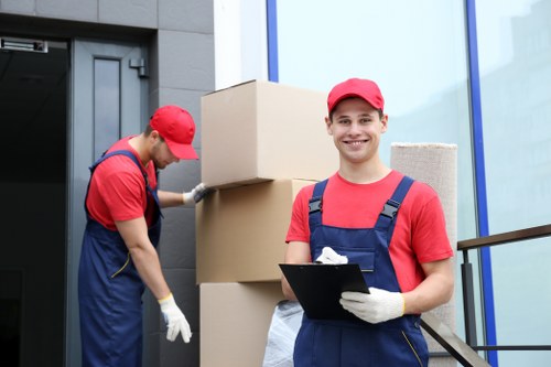 Local home move preparation with labelled boxes and wrapped furniture