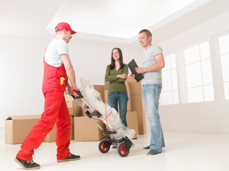 Safety-focused removal van team inspecting equipment before a move