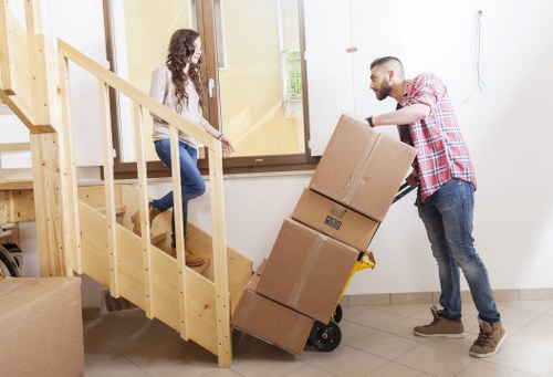 Packed boxes and furniture ready for a local home move in Catford