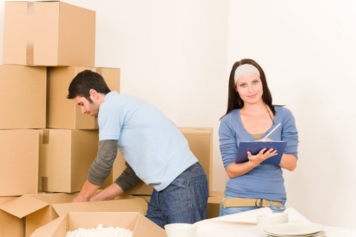 Packed moving boxes and furniture ready for house removals in Catford